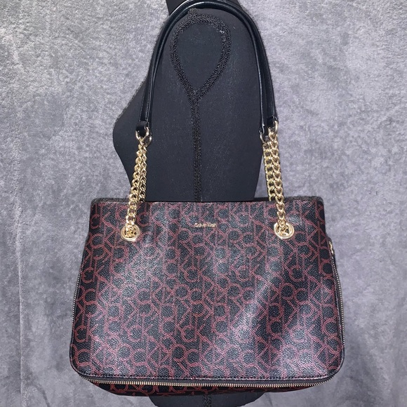 Calvin Klein Handbags - Calvin Klein Gold Chain Shoulder Bag With A Red Monogram Logo And Zipper
